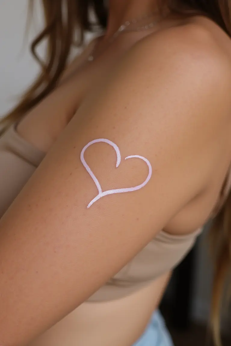 White Ink Heart Tattoo