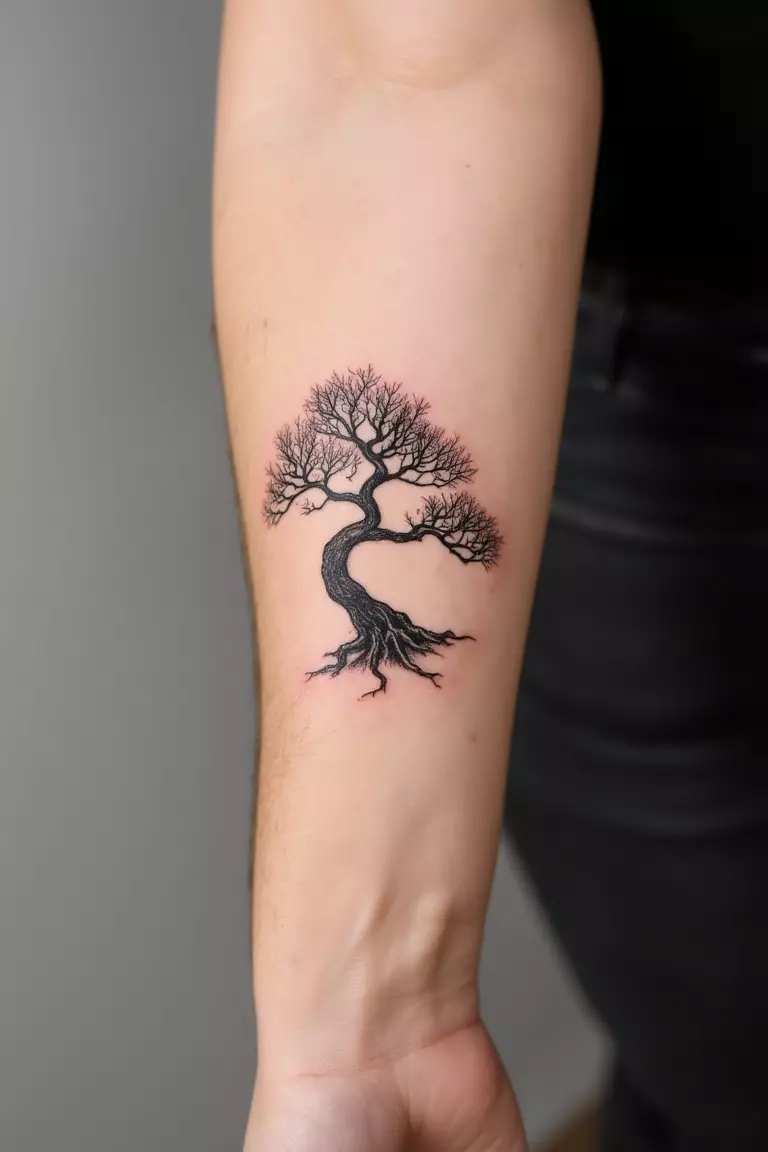 Minimalist Bonsai Tree Silhouette A close up shot of woman's arm with a black ink minimalist bonsai tree silhouette tattoo
